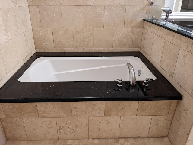 bathroom featuring a relaxing tiled tub