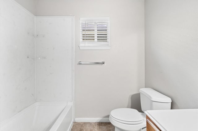 bathroom featuring vanity, baseboards, and toilet