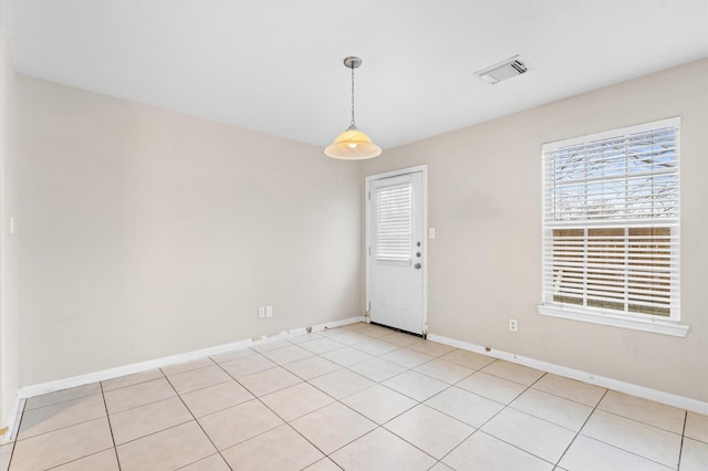 empty room with visible vents and baseboards