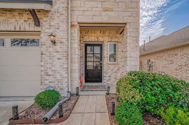 property entrance with a garage