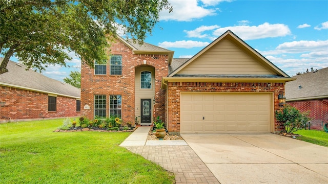 traditional-style house featuring brick siding, a shingled roof, concrete driveway, an attached garage, and a front lawn