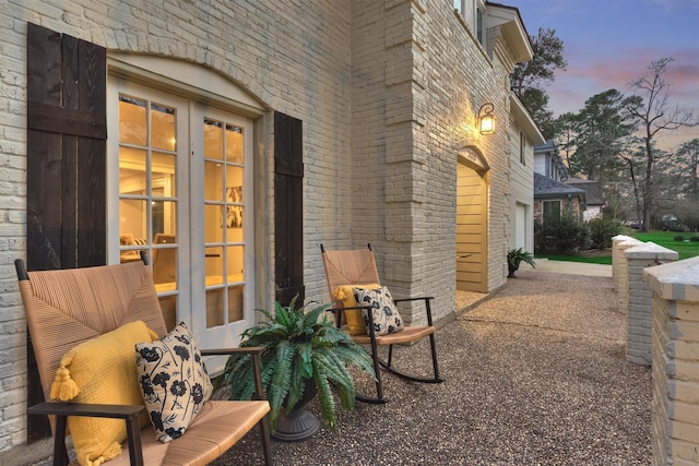 patio terrace at dusk with a garage