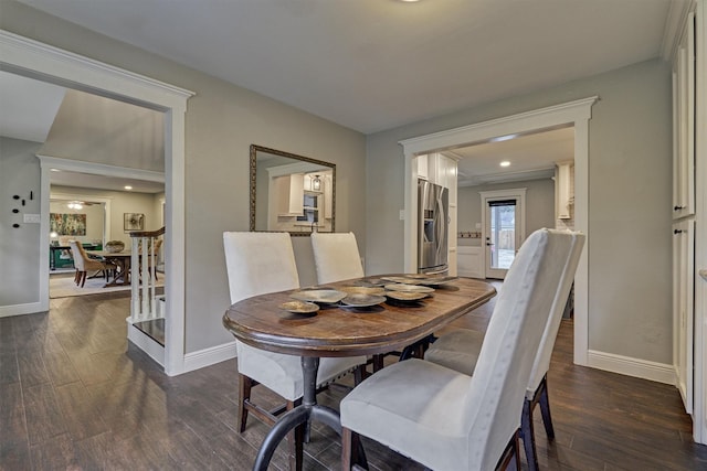 dining space featuring dark wood-type flooring