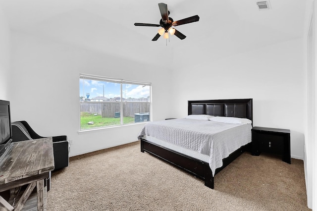 carpeted bedroom with visible vents, ceiling fan, and baseboards