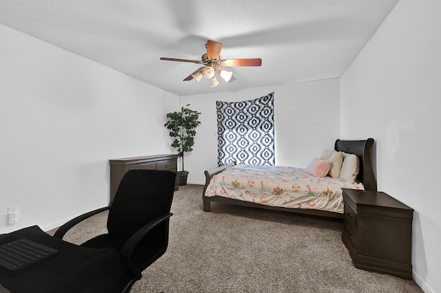 bedroom featuring light colored carpet, ceiling fan, and baseboards