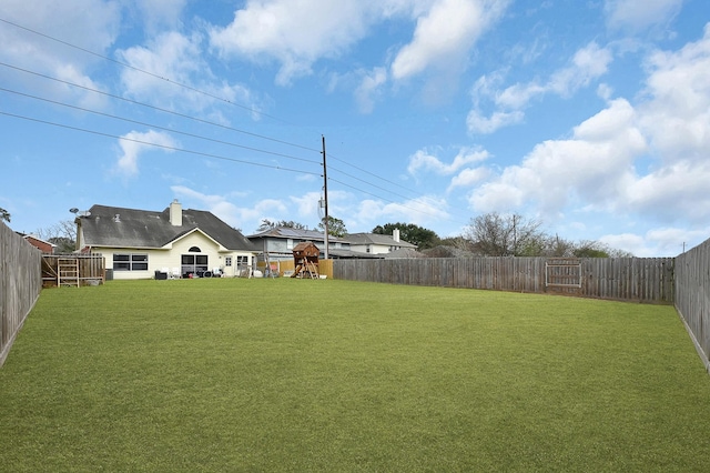 view of yard featuring a fenced backyard