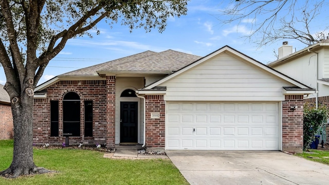 ranch-style house featuring a garage and a front yard