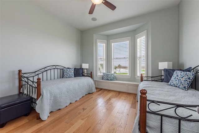 bedroom with ceiling fan and light wood-type flooring