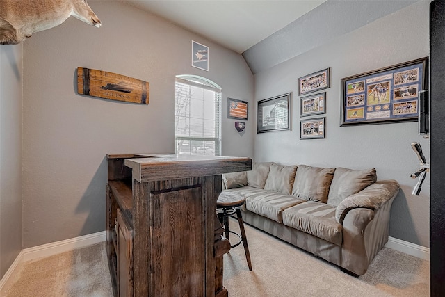 interior space with light carpet and lofted ceiling