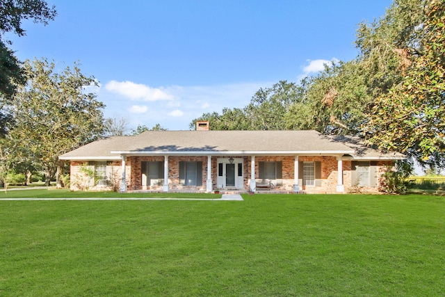 view of front of property with a front yard and a porch