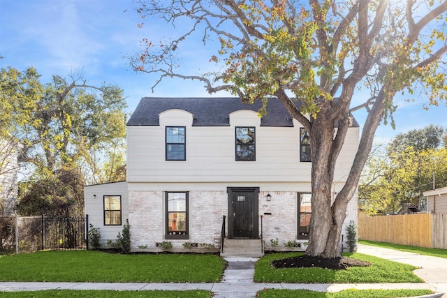 view of front of property with a front lawn