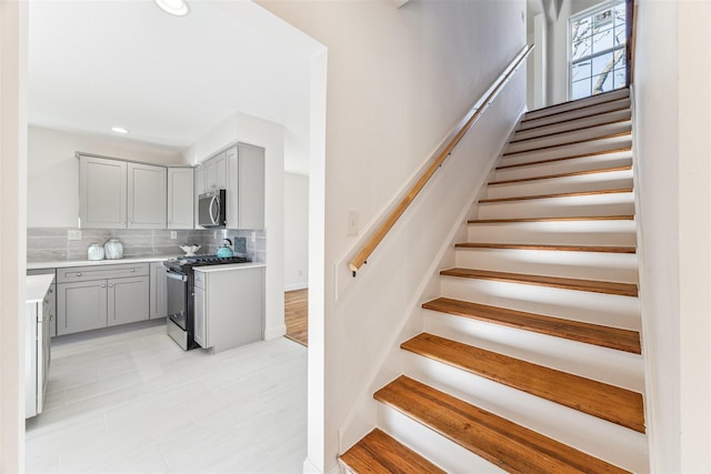 staircase with recessed lighting