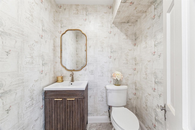 bathroom with toilet and vanity