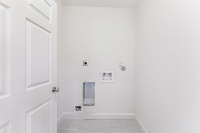 laundry room featuring hookup for a gas dryer, hookup for an electric dryer, laundry area, washer hookup, and baseboards