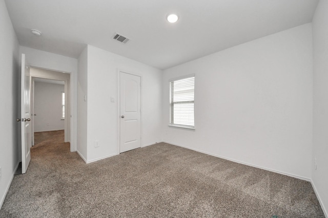 unfurnished bedroom with carpet floors