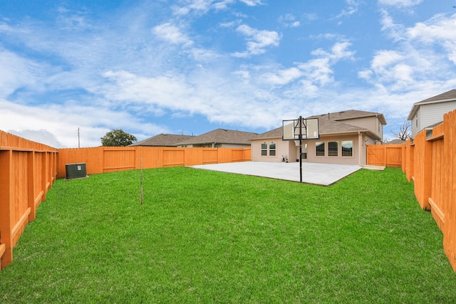 rear view of house with a lawn and a patio area