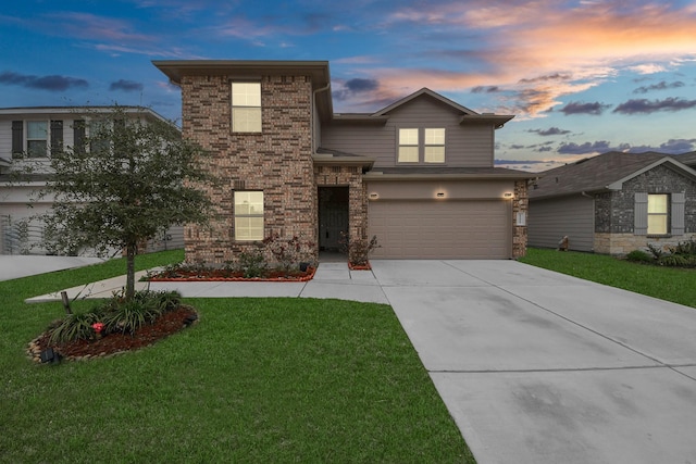 view of front property with a garage and a yard