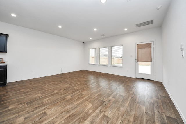 unfurnished living room featuring dark hardwood / wood-style flooring