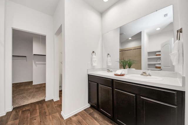 bathroom featuring vanity and hardwood / wood-style floors