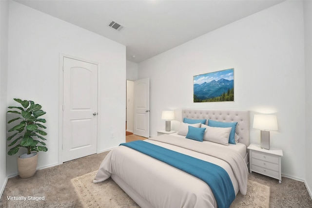 bedroom featuring light colored carpet