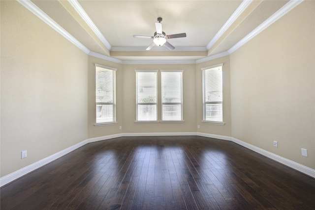 spare room featuring dark hardwood / wood-style flooring, crown molding, a raised ceiling, and ceiling fan