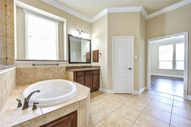 bathroom featuring vanity, ornamental molding, tile patterned floors, and tiled bath