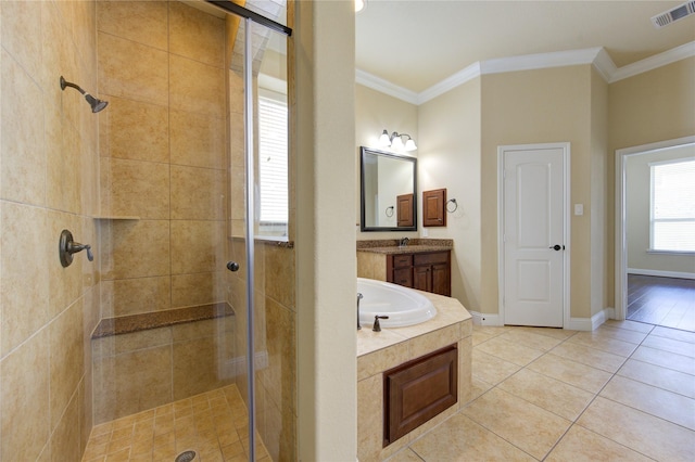 bathroom featuring crown molding, vanity, shower with separate bathtub, and tile patterned flooring