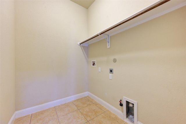 clothes washing area with hookup for a gas dryer, hookup for a washing machine, hookup for an electric dryer, and light tile patterned floors