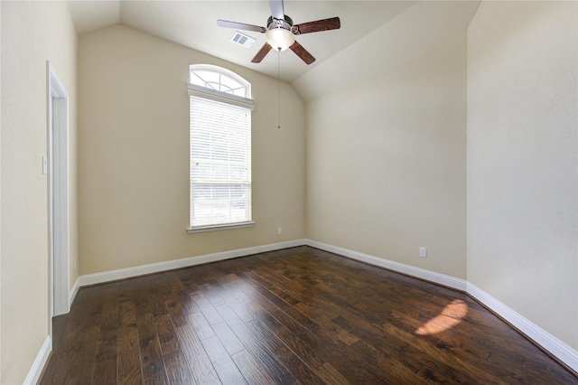 spare room with vaulted ceiling, ceiling fan, and dark hardwood / wood-style flooring