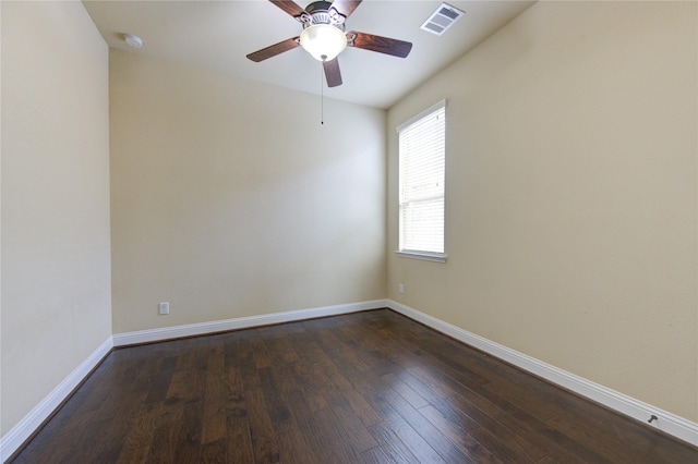 empty room with dark wood-type flooring and ceiling fan