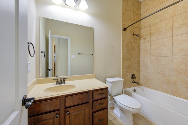 full bathroom with tiled shower / bath combo, vanity, tile patterned floors, and toilet