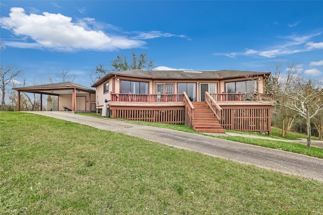 view of front facade featuring a deck and a front lawn