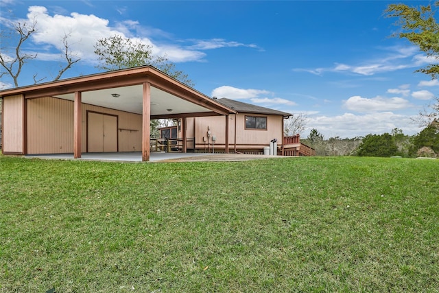 40 Pecan Cv, Coldspring, TX 77331 - rear view of property featuring a lawn