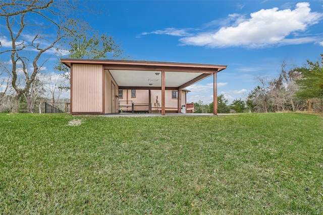 40 Pecan Cv, Coldspring, TX 77331 - rear view of house featuring a lawn