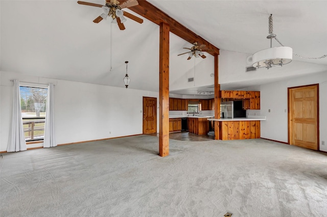 40 Pecan Cv, Coldspring, TX 77331 - unfurnished living room featuring light carpet, beam ceiling, high vaulted ceiling, and ceiling fan