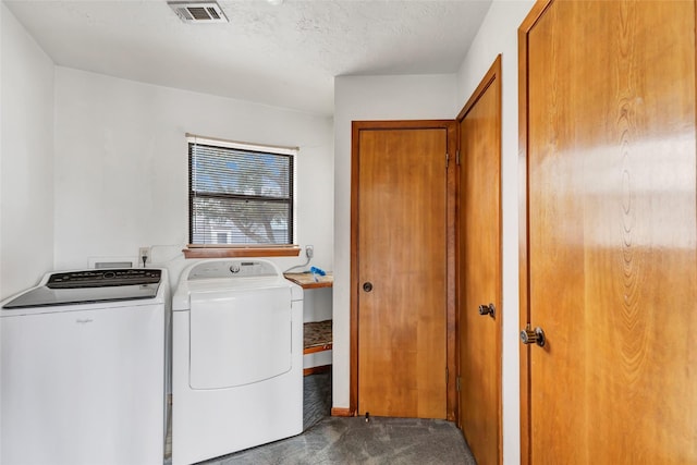 40 Pecan Cv, Coldspring, TX 77331 - laundry area with washer and dryer, a textured ceiling, and dark carpet