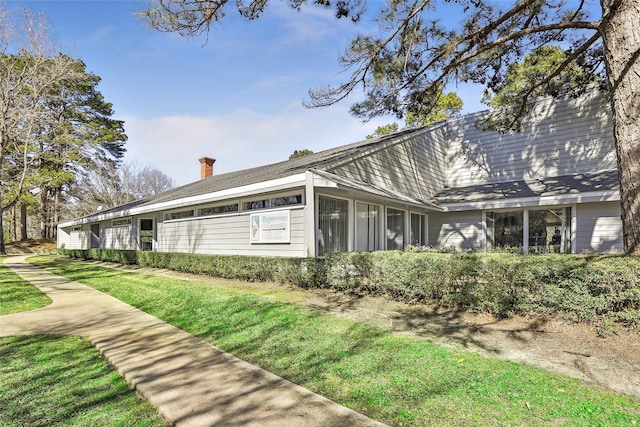40 Pecan Cv, Coldspring, TX 77331 - view of property exterior with a lawn