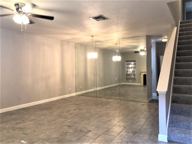 interior space featuring ceiling fan