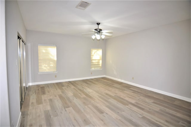 unfurnished room featuring ceiling fan and light wood-type flooring