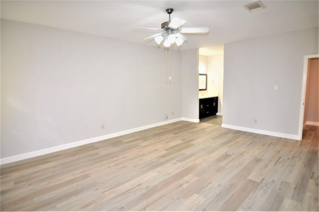 unfurnished living room featuring ceiling fan and light hardwood / wood-style floors