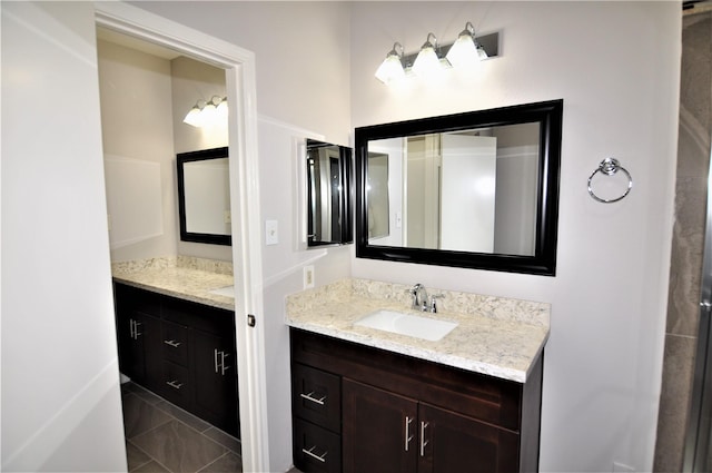 bathroom with vanity and tile patterned flooring