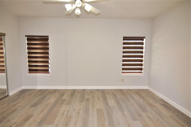 spare room featuring ceiling fan and light wood-type flooring