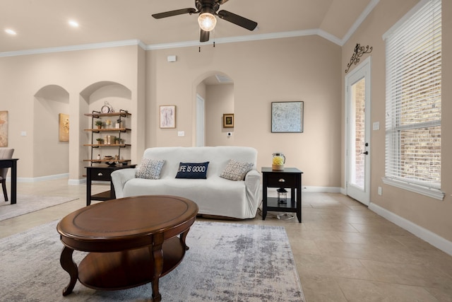 living room featuring crown molding and baseboards