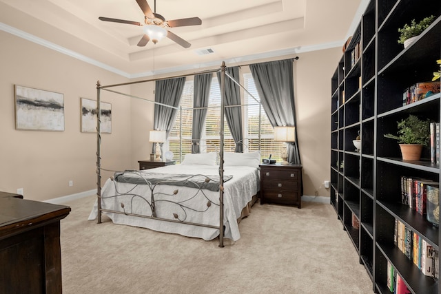 bedroom with carpet floors, baseboards, visible vents, and a raised ceiling