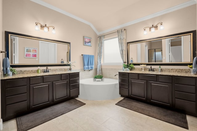 full bath with lofted ceiling, a sink, two vanities, ornamental molding, and a bath