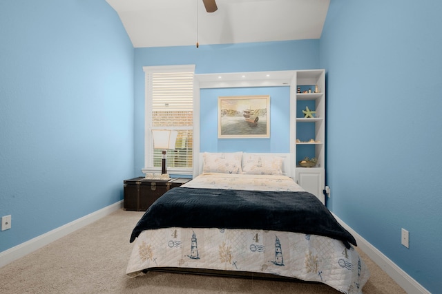 carpeted bedroom featuring lofted ceiling, ceiling fan, and baseboards