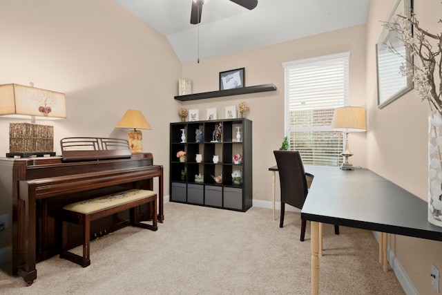 office space featuring lofted ceiling, ceiling fan, carpet floors, and baseboards