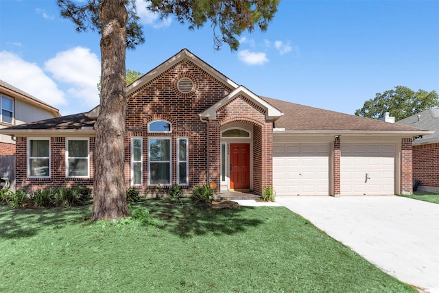 view of front of house featuring a garage and a front yard