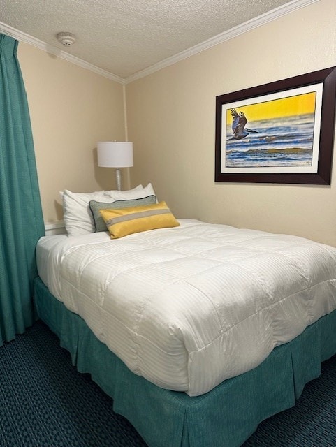 6102 Seawall Blvd Unit 128, Galveston, TX 77551 - carpeted bedroom with a textured ceiling and crown molding