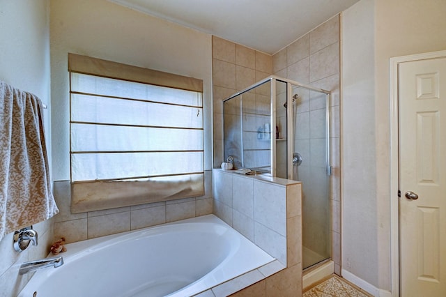 bathroom with shower with separate bathtub